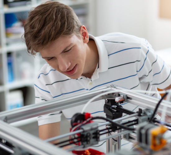 Male working on 3D printer